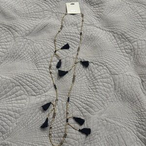 Long Gold Beaded Necklace with Black Tassels